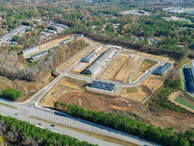 a aerial view of a house with a yard