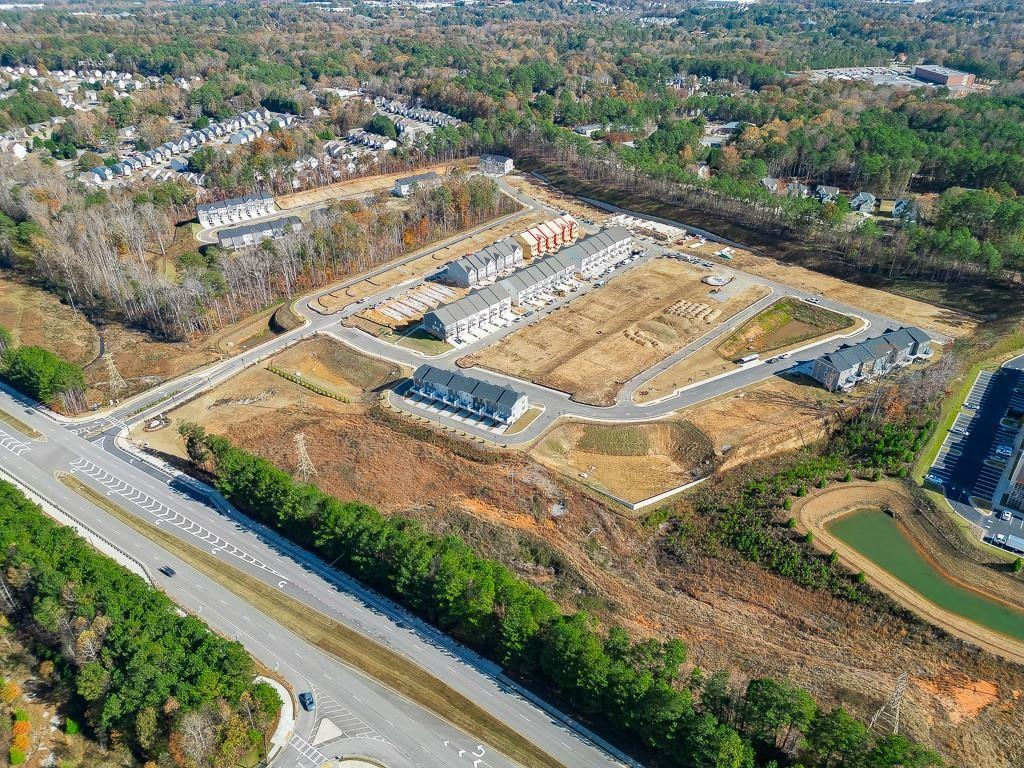 761 Woods Chapel Road Sugar Hill, GA 30518 - Photo 39 of 67 an aerial view of residential houses with yard