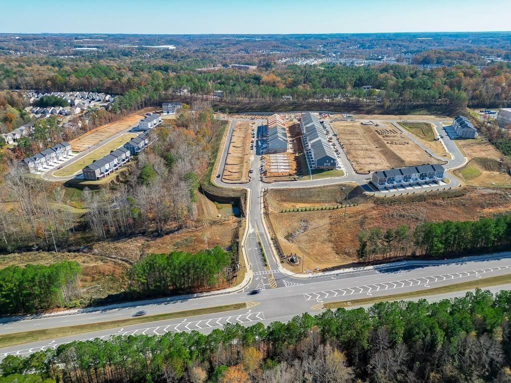 761 Woods Chapel Road Sugar Hill, GA 30518 - Photo 40 of 67 an aerial view of residential houses with outdoor space