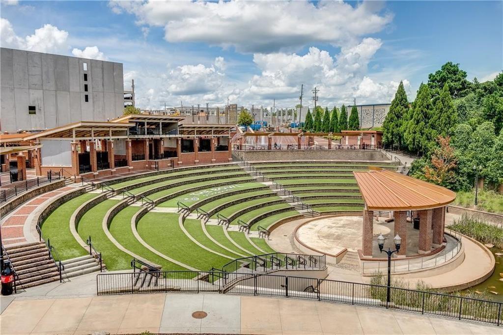 761 Woods Chapel Road Sugar Hill, GA 30518 - Photo 44 of 67 a swimming pool with outdoor seating