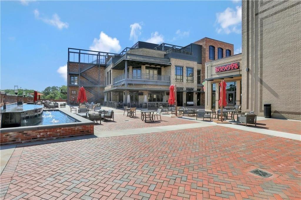 761 Woods Chapel Road Sugar Hill, GA 30518 - Photo 55 of 67 a front view of a building with street view