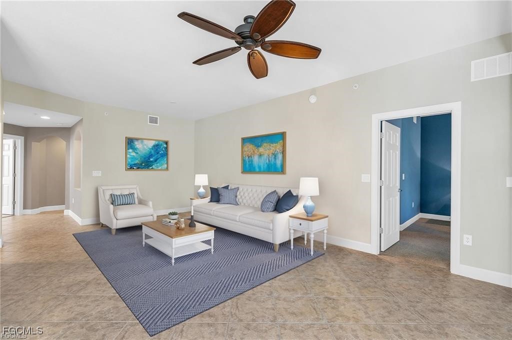 12905 New Market Street, Unit 102 Fort Myers, FL 33913 - Photo 12 of 30 a living room with couches and a view of kitchen