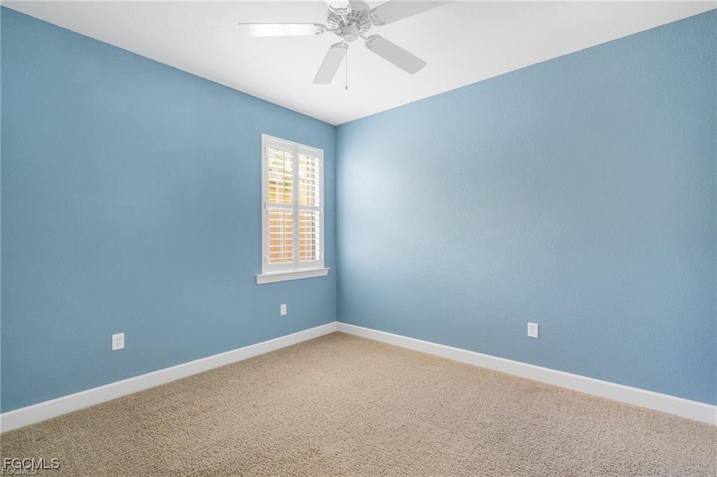 12905 New Market Street, Unit 102 Fort Myers, FL 33913 - Photo 17 of 30 an empty room with a window and a fan