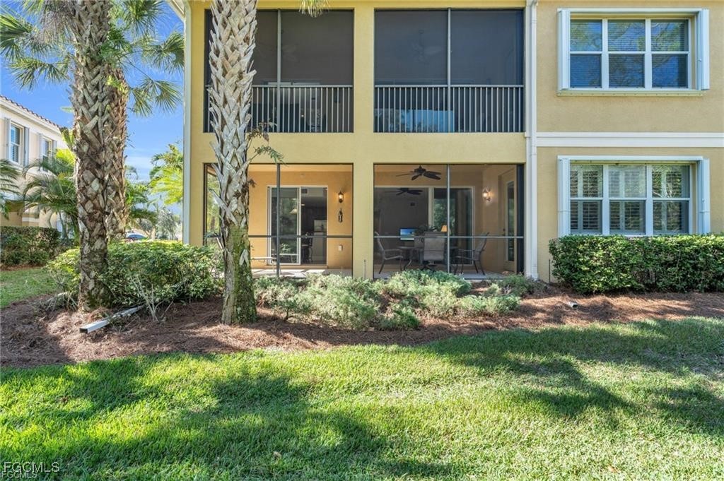 12905 New Market Street, Unit 102 Fort Myers, FL 33913 - Photo 26 of 30 a view of a building with a garden