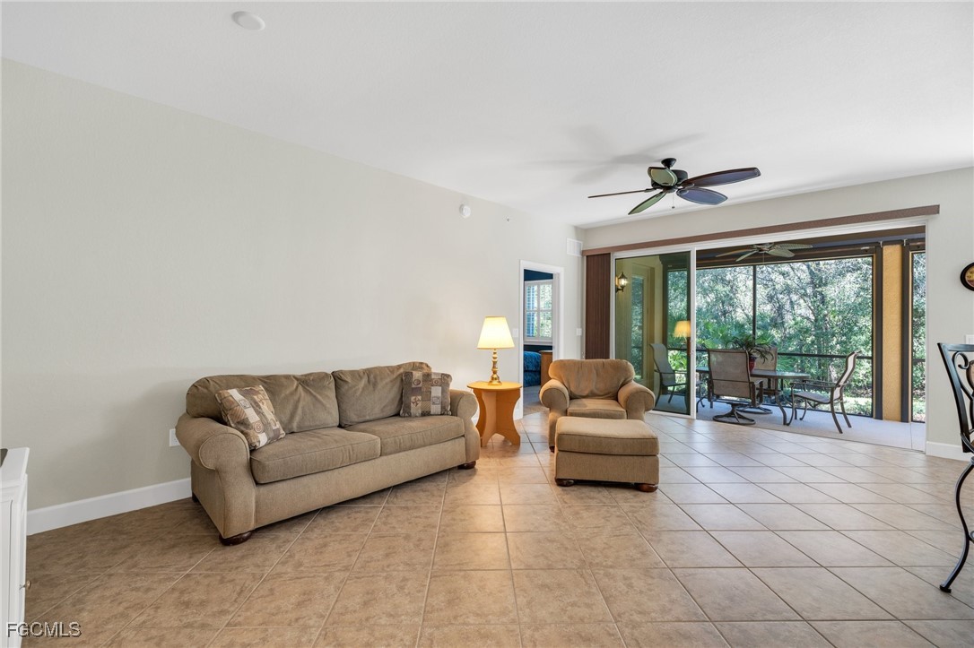 12905 New Market Street, Unit 102 Fort Myers, FL 33913 - Photo 9 of 30 a living room with furniture and a large window