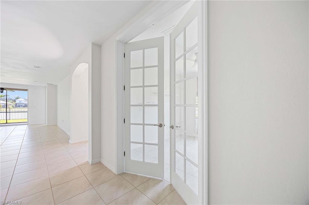 14799 Edgewater Circle Naples, FL 34114 - Photo 17 of 35 an empty room with windows