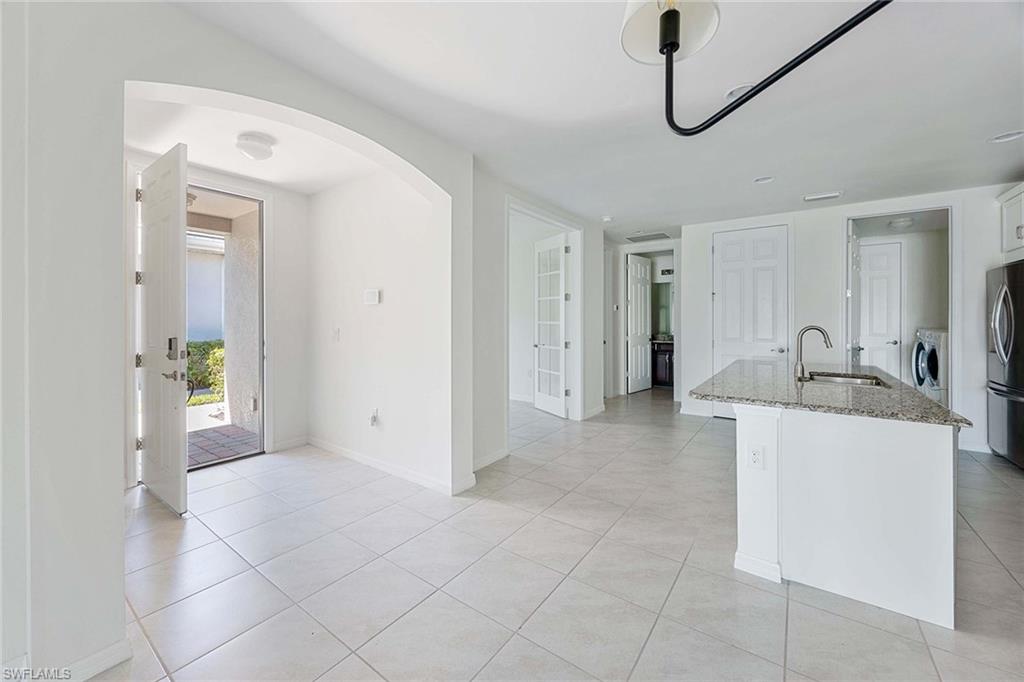 14799 Edgewater Circle Naples, FL 34114 - Photo 6 of 35 a view of a storage & utility room