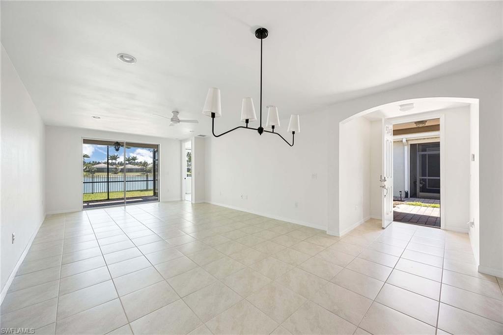 14799 Edgewater Circle Naples, FL 34114 - Photo 8 of 35 a view of an empty room with a window