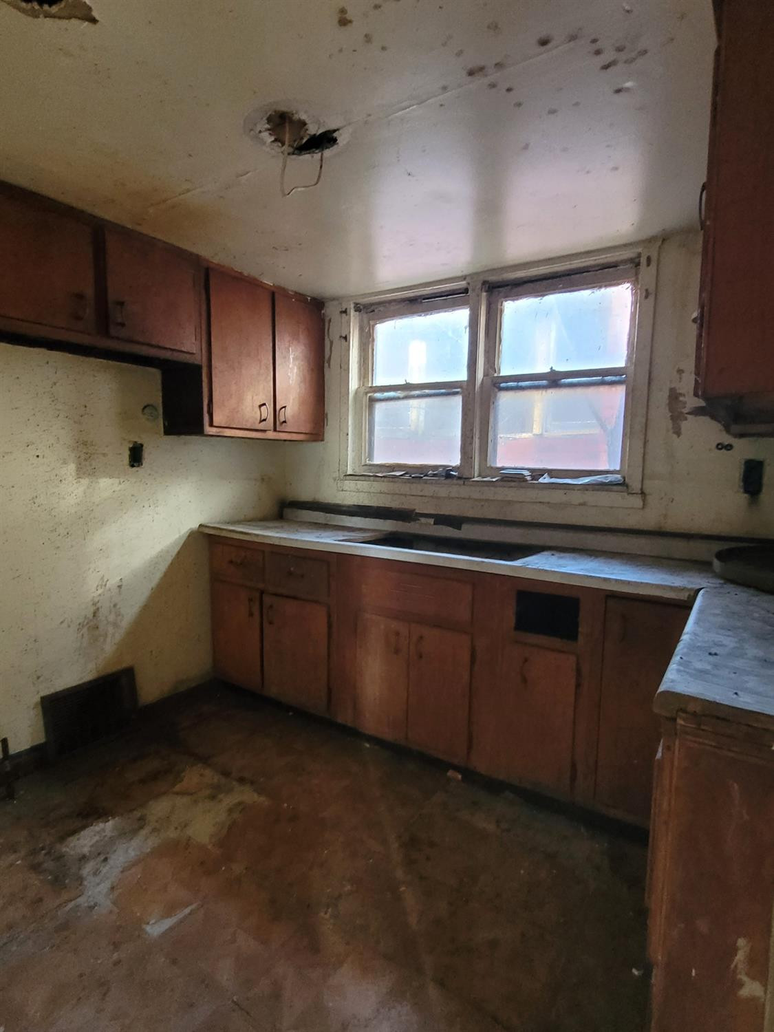 1736 Fillmore Street Gary, IN 46407 - Photo 4 of 14 a kitchen with stainless steel appliances granite countertop a sink a stove cabinets and wooden floor