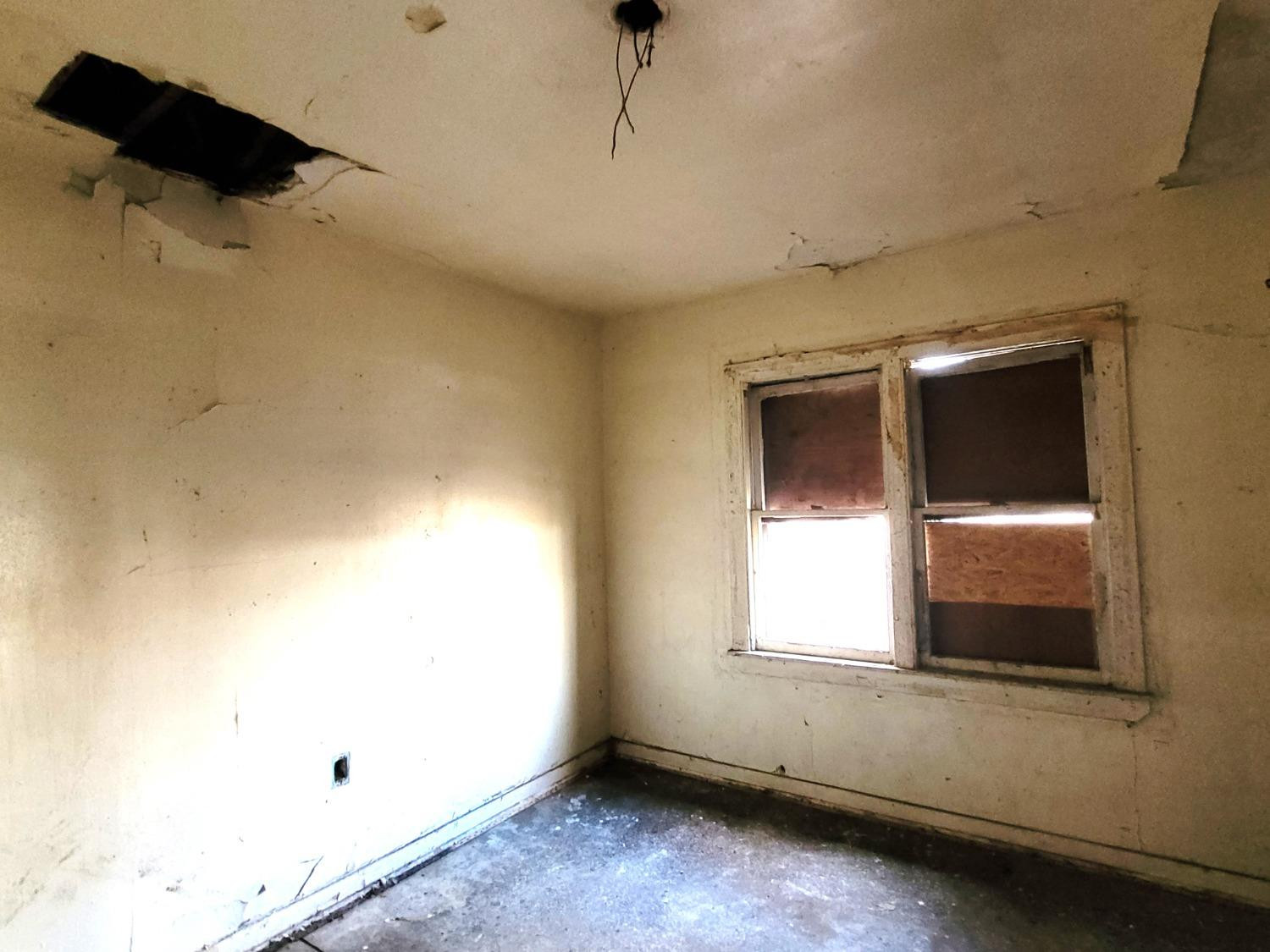 1736 Fillmore Street Gary, IN 46407 - Photo 9 of 14 a view of an empty room with a window