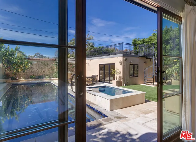 a view of swimming pool with patio
