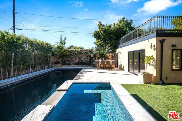 a view of swimming pool with patio