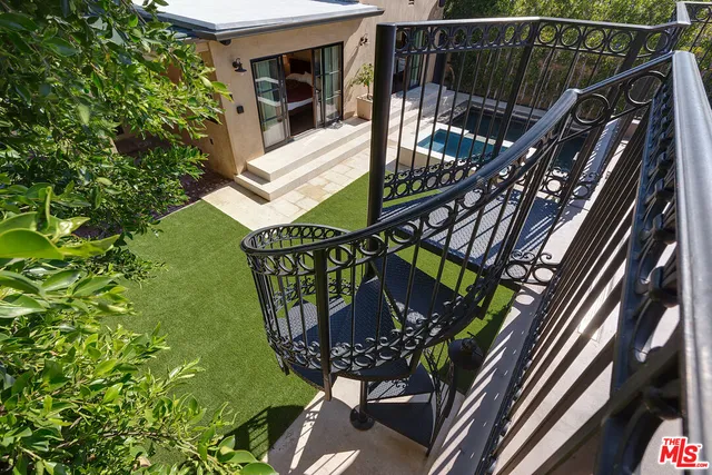 a view of balcony with furniture