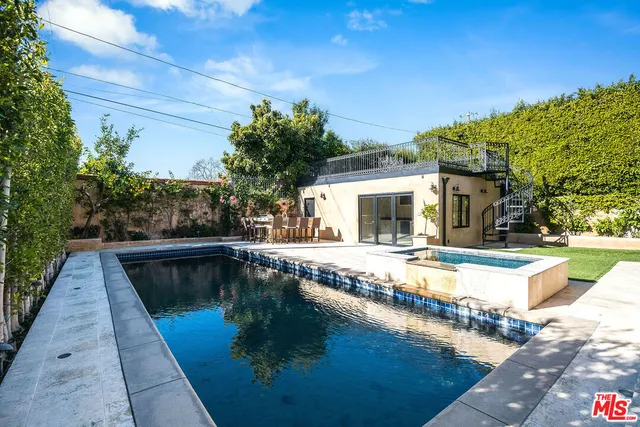 a view of a house with swimming pool