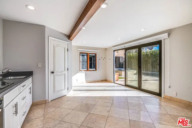 a spacious bedroom with a large bed and a large window