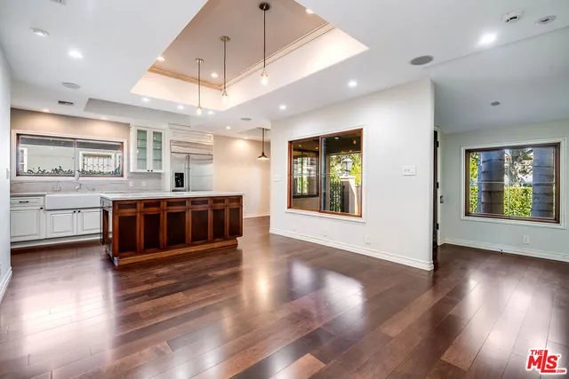 a large hall with lots of wooden furniture and a fireplace