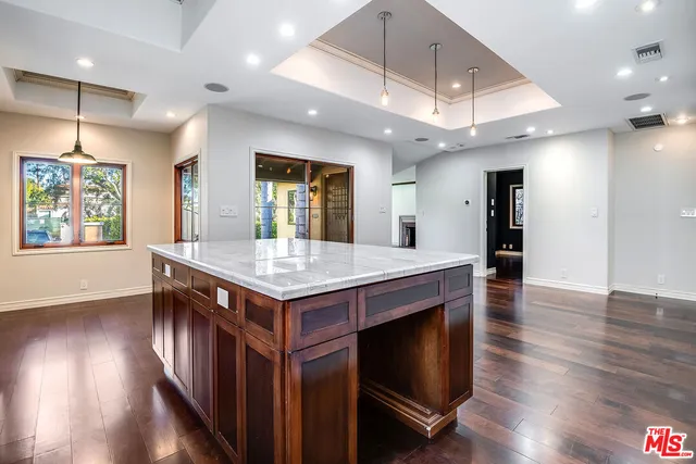 an open kitchen with a table and chairs