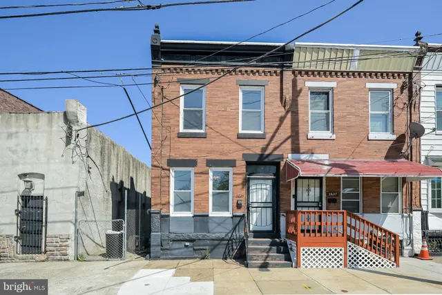 a front view of a building with a glass door