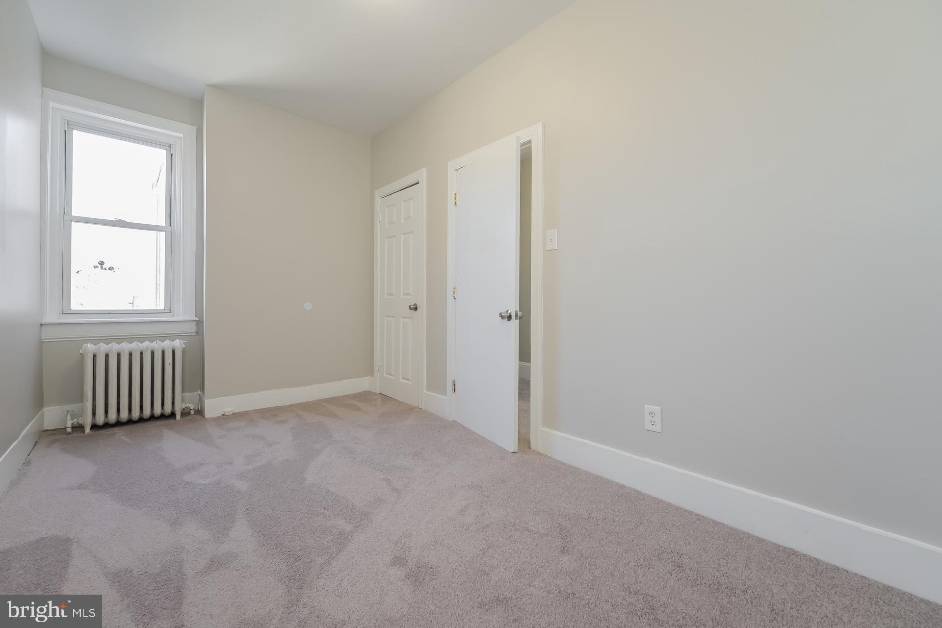 2629 North 34th Street Philadelphia, PA 19132 - Photo 8 of 10 an empty room with a window