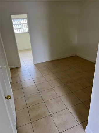 a view of a utility room and window in a room