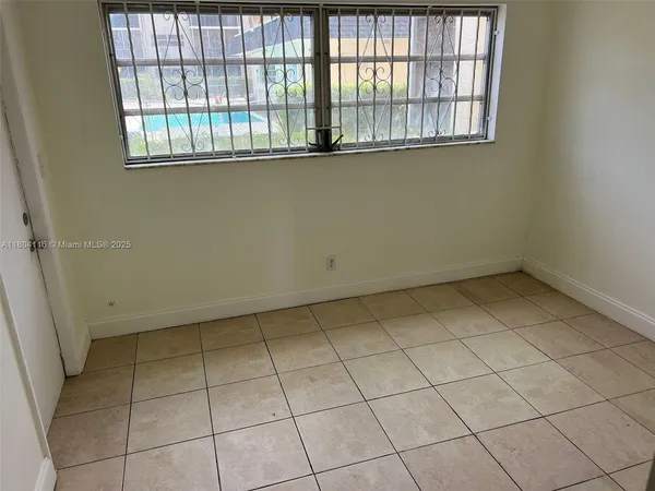 a kitchen with a refrigerator sink and cabinets