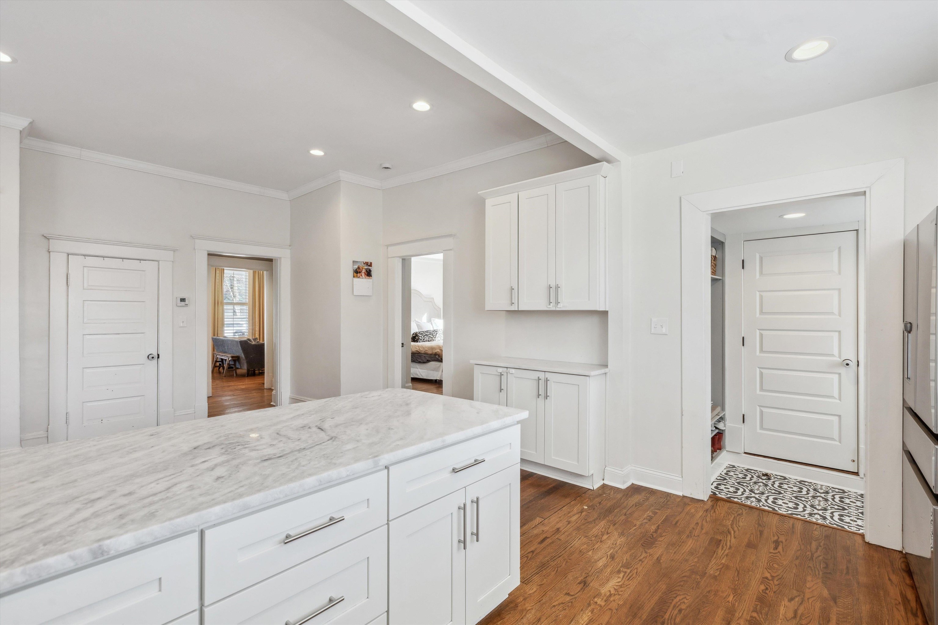 779 Roland Street Memphis, TN 38104 - Photo 12 of 29 a spacious bathroom with a granite countertop sink and a mirror