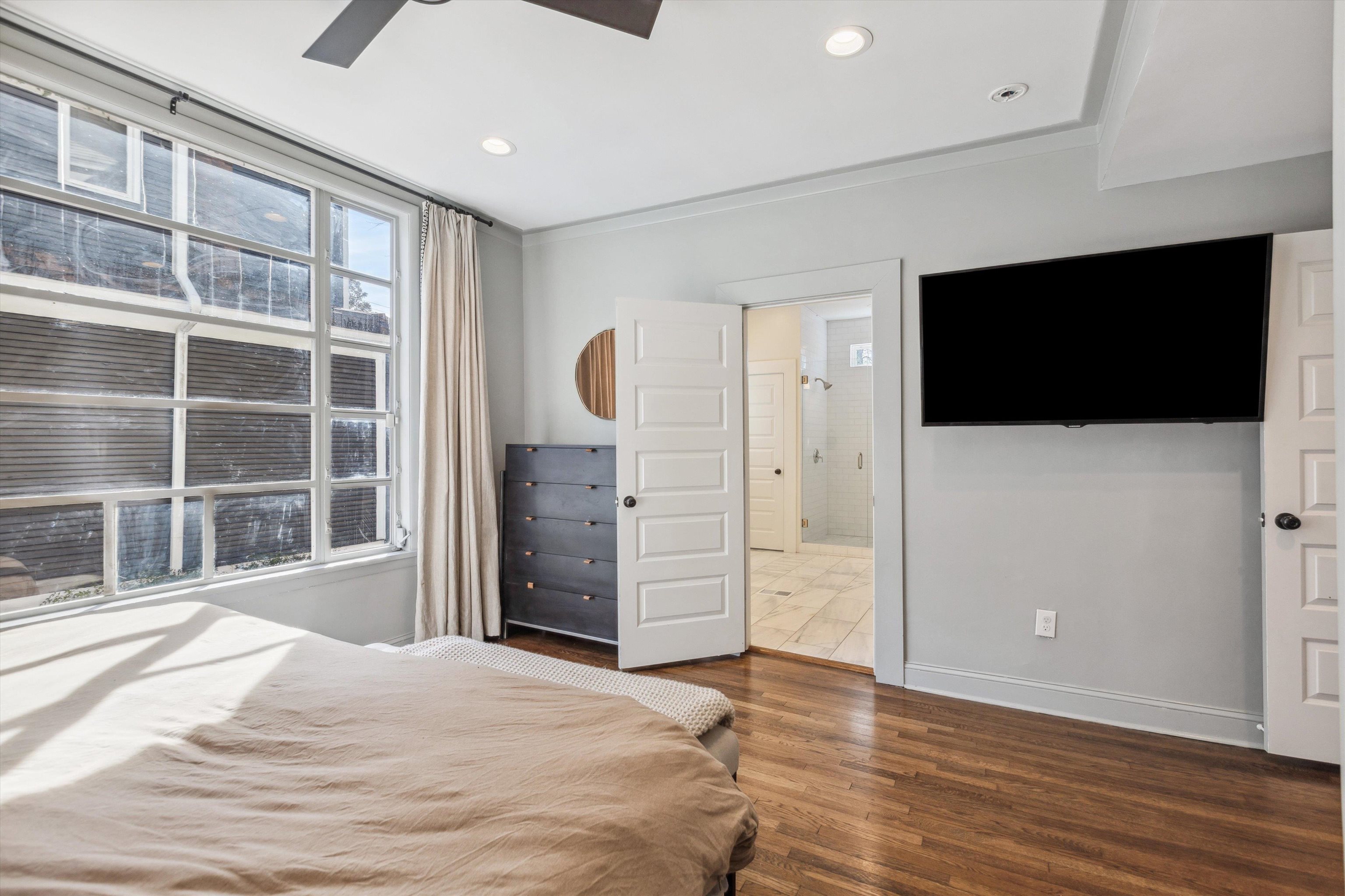 779 Roland Street Memphis, TN 38104 - Photo 14 of 29 a bedroom with a bed and a flat screen tv