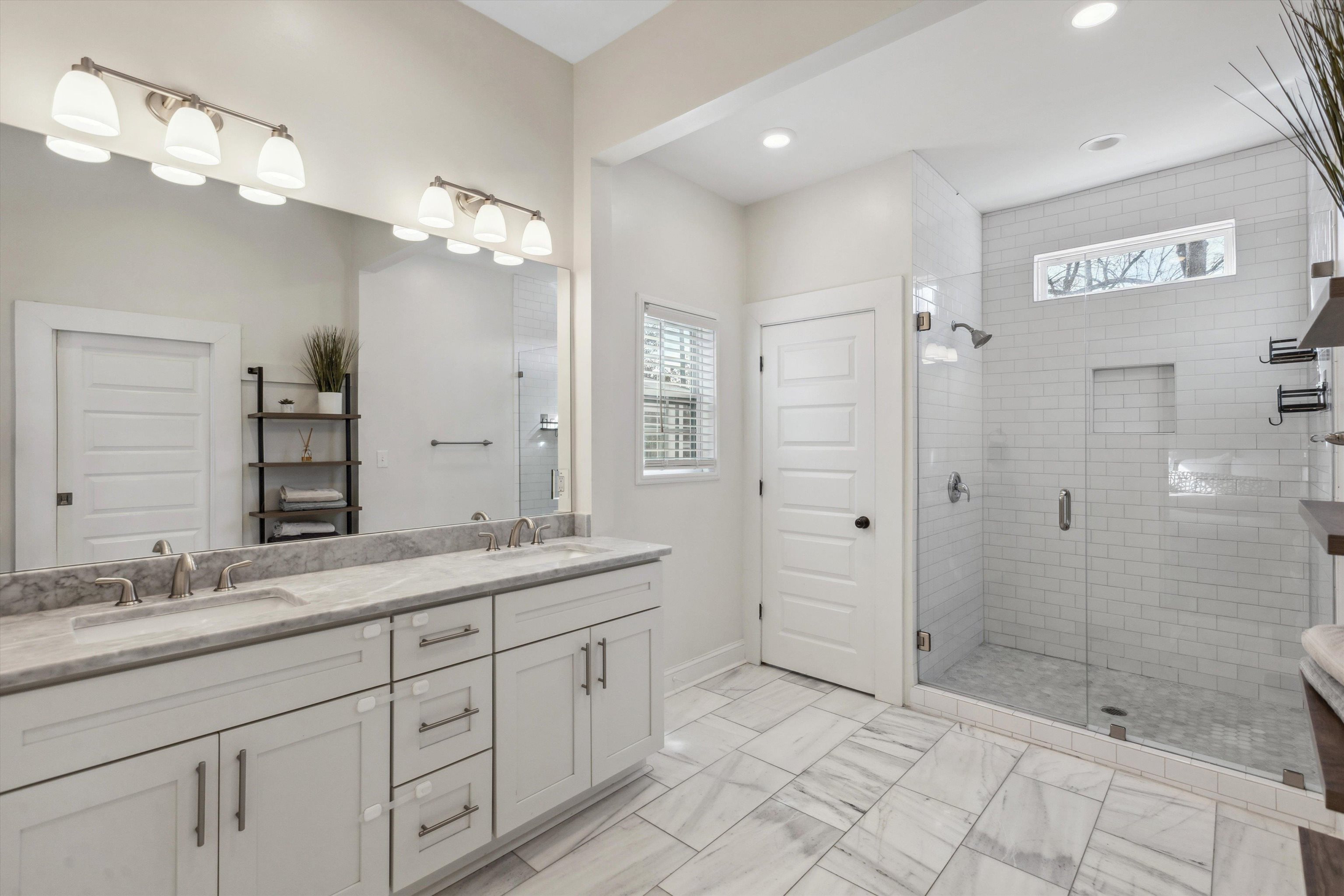 779 Roland Street Memphis, TN 38104 - Photo 15 of 29 a bathroom with a shower sink and mirror