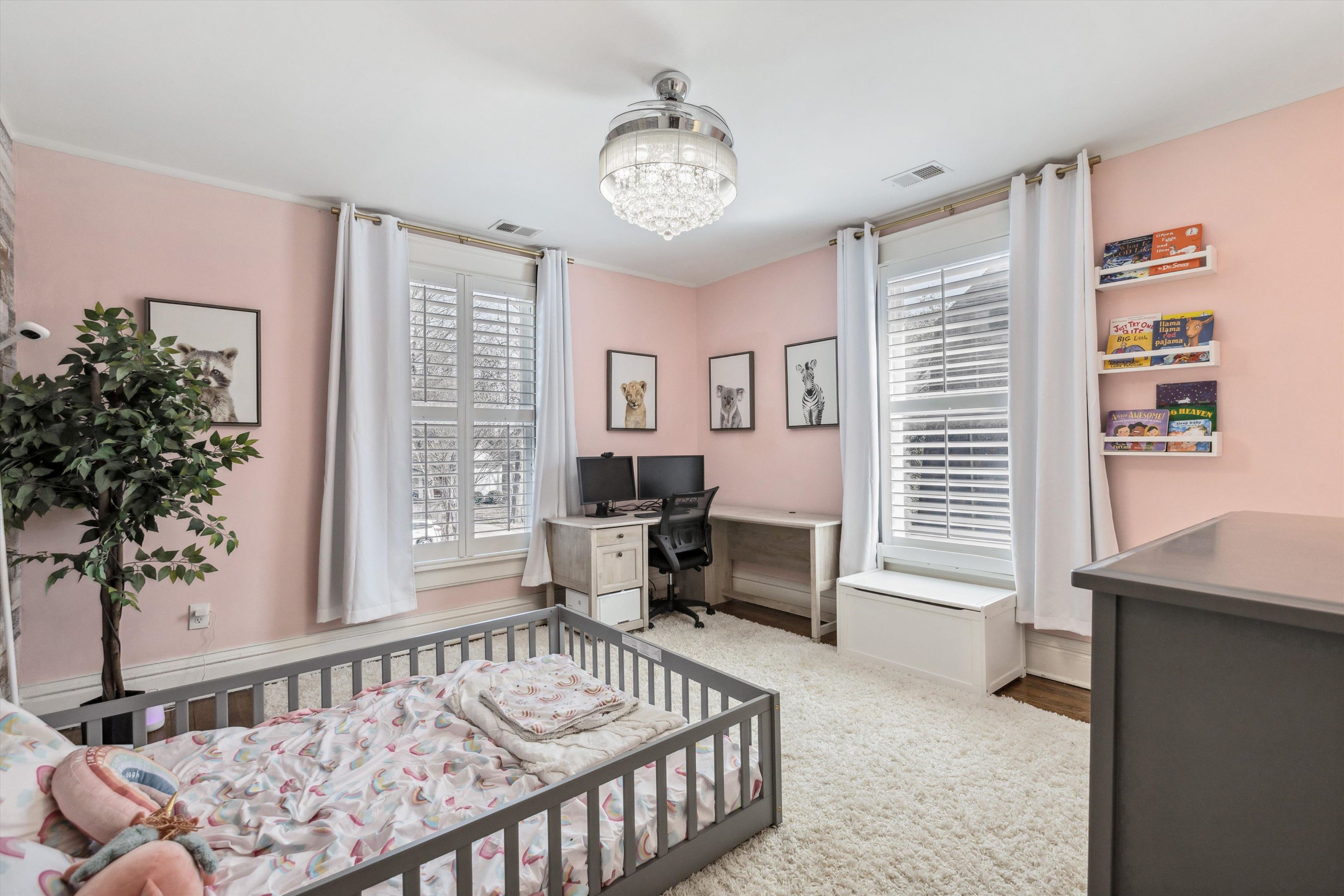 779 Roland Street Memphis, TN 38104 - Photo 18 of 29 a bedroom with furniture and a large window