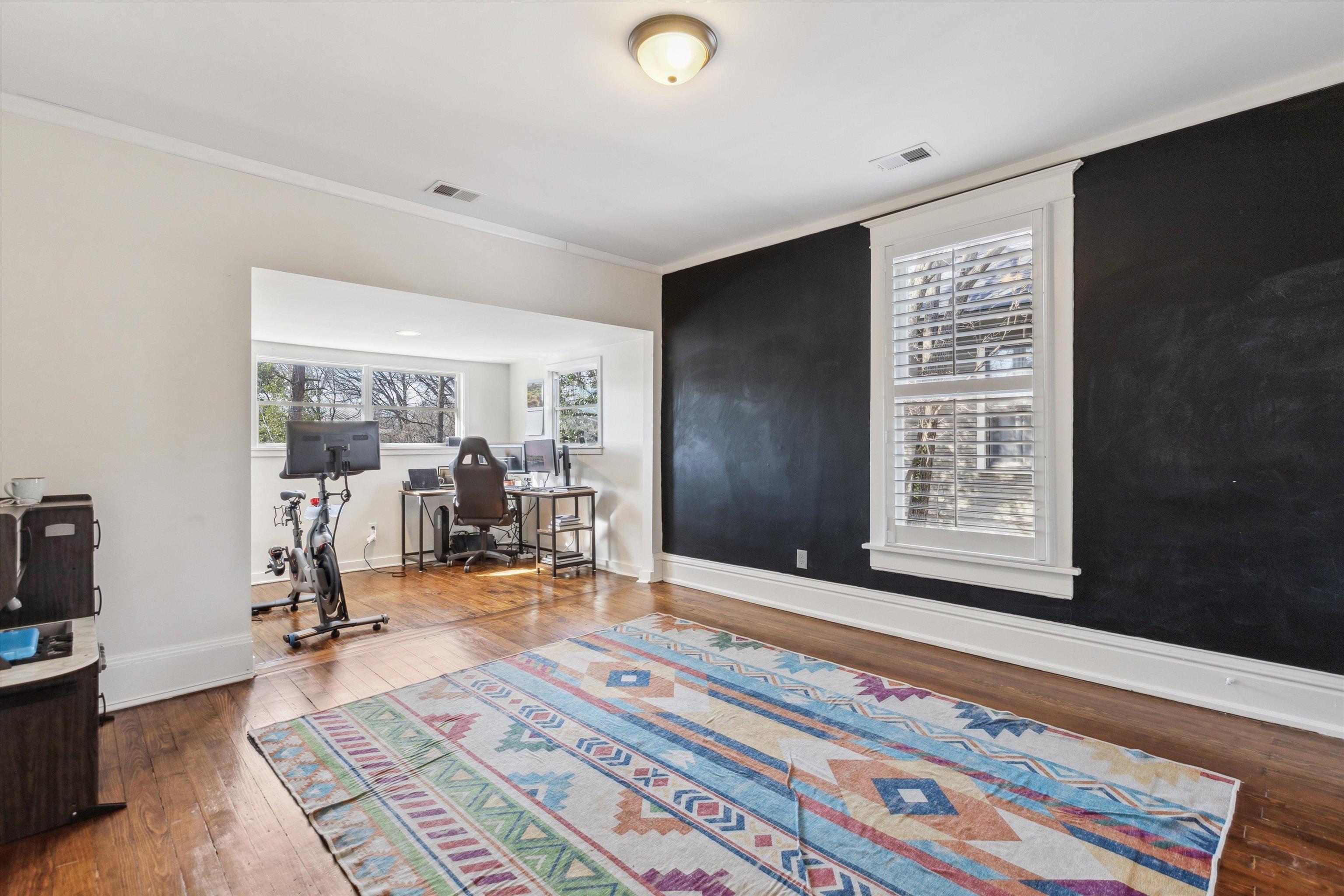 779 Roland Street Memphis, TN 38104 - Photo 22 of 29 a view of a room with gym equipment and floor to ceiling window
