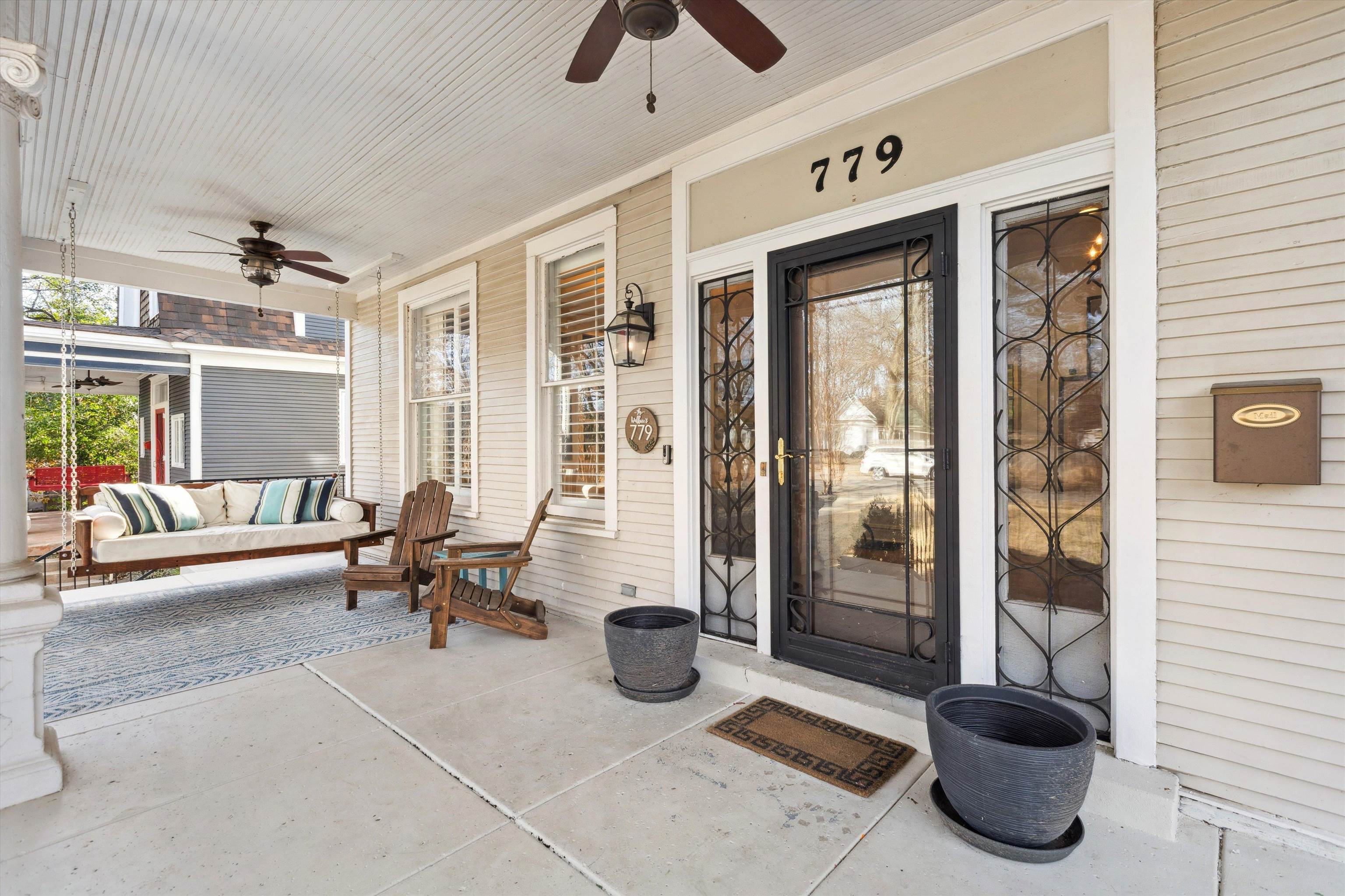 779 Roland Street Memphis, TN 38104 - Photo 3 of 29 a living room with furniture and a floor to ceiling window