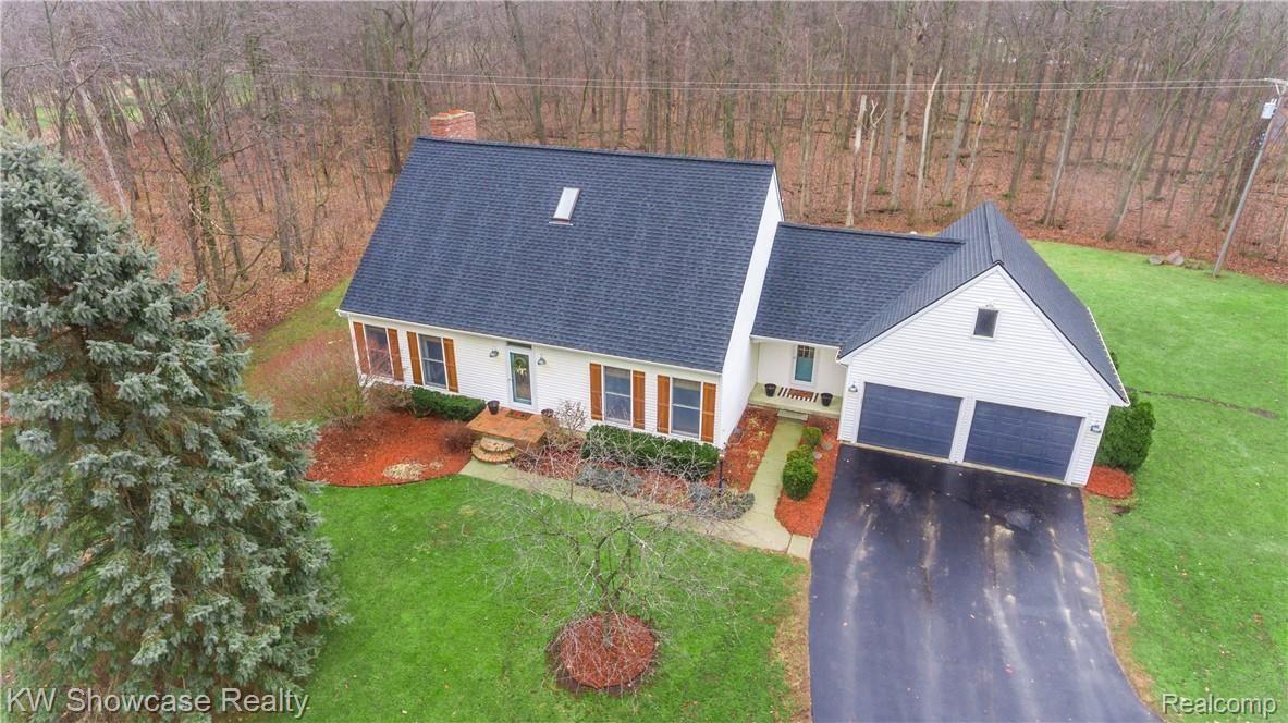 1422 North Hacker Road Howell, MI 48843 - Photo 3 of 44 The roof was new in 2016 as you can clearly see in this drone picture.