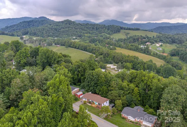 an aerial view of lake and residential houses