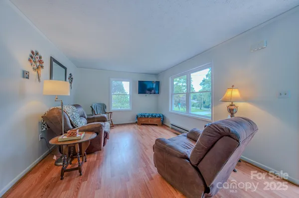 a living room with furniture and a window