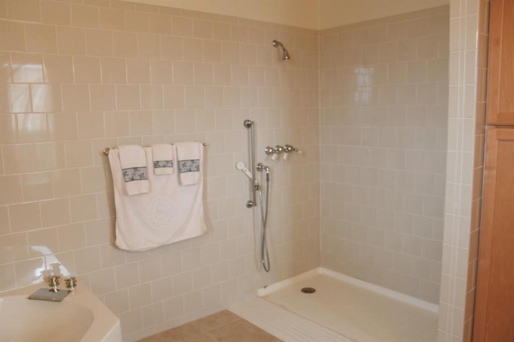 1365 Signal Road Quinlan, TX 75474 - Photo 13 of 33 a bathroom with a shower