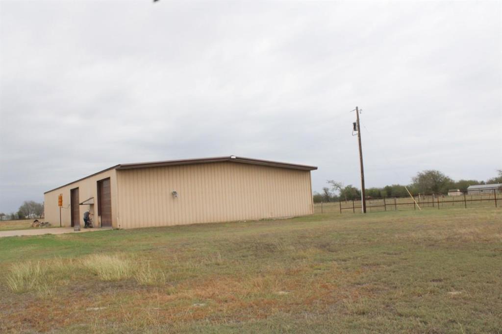 1365 Signal Road Quinlan, TX 75474 - Photo 25 of 33 a backyard of a house with lots of green space