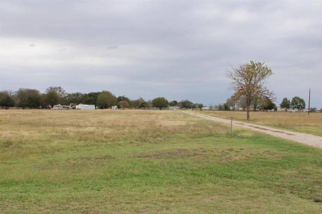 1365 Signal Road Quinlan, TX 75474 - Photo 4 of 33 a view of a lake with a big yard