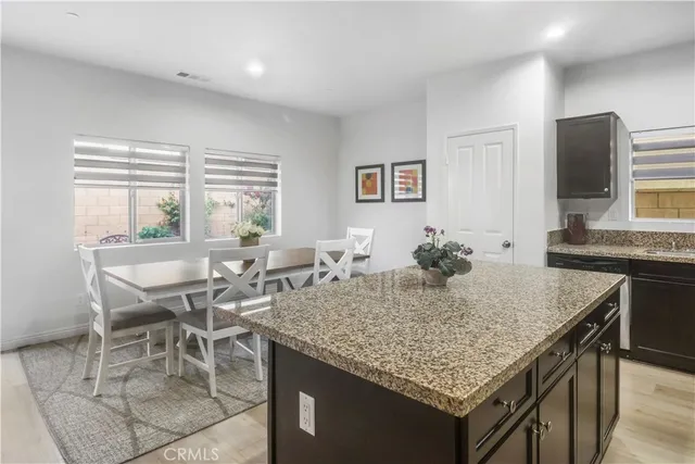 a view of a kitchen area with furniture and a window
