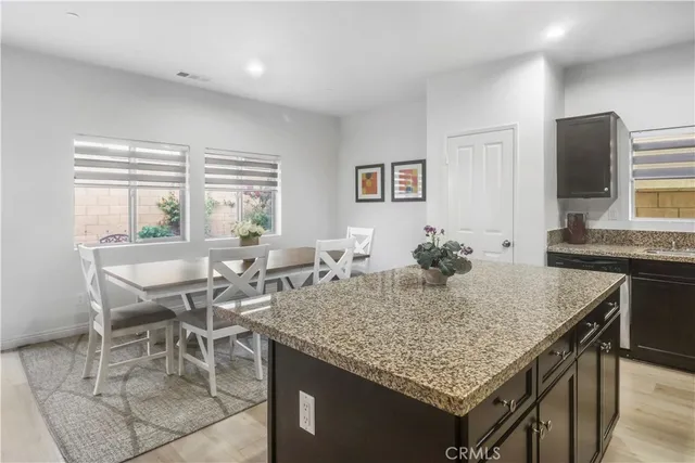 a view of a kitchen area with furniture and a window