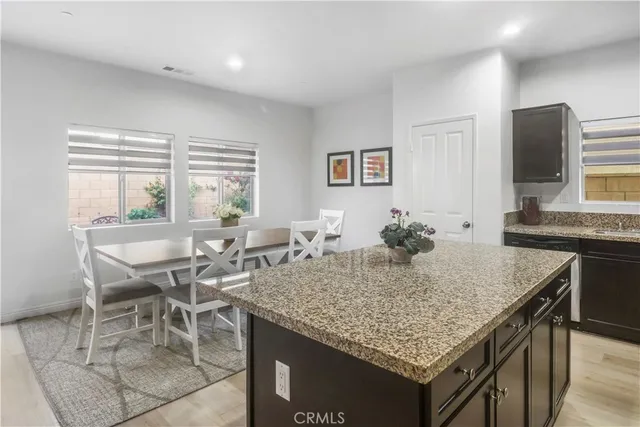 a view of a kitchen area with furniture and a window