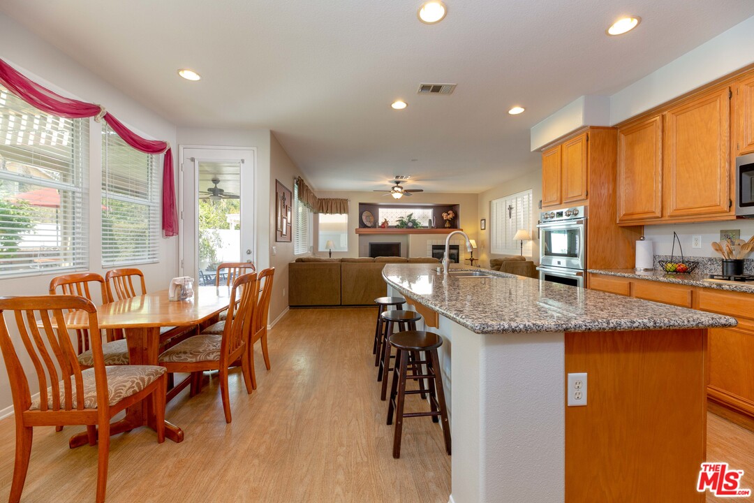 6847 Raspberry Court Eastvale, CA 92880 - Photo 15 of 49 a kitchen with granite countertop lots of counter top space