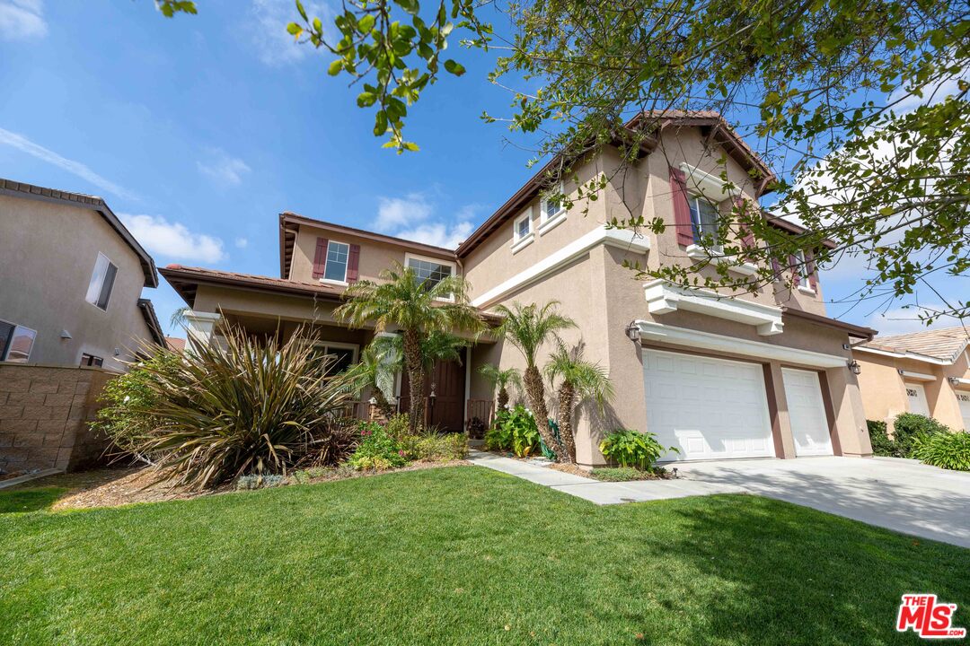 6847 Raspberry Court Eastvale, CA 92880 - Photo 3 of 49 a view of a house with a yard