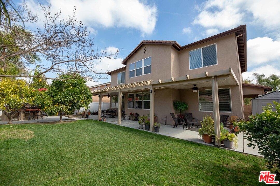 6847 Raspberry Court Eastvale, CA 92880 - Photo 40 of 49 a view of a house with a yard porch and sitting area