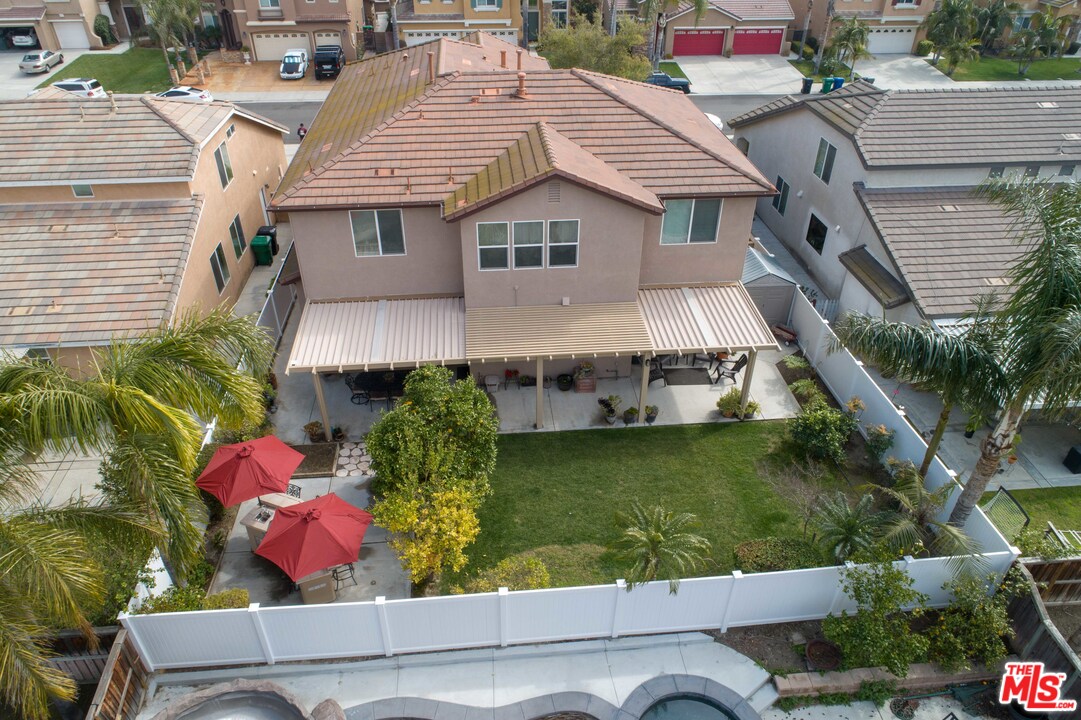 6847 Raspberry Court Eastvale, CA 92880 - Photo 47 of 49 an aerial view of a house with a yard