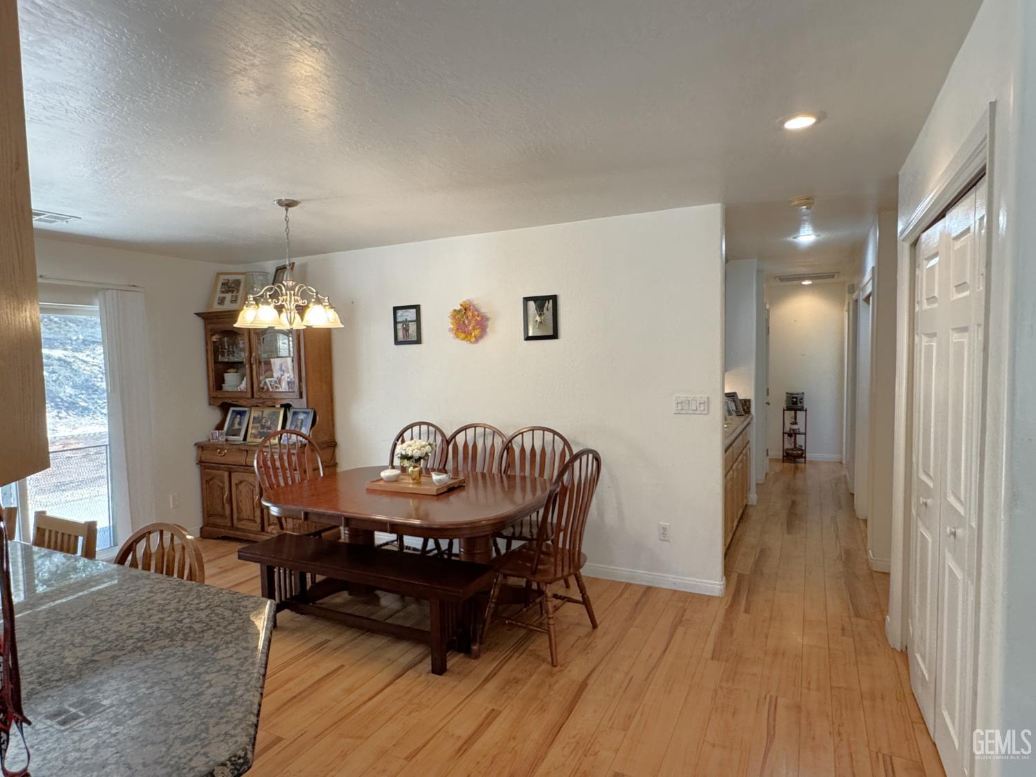 Undisclosed Address Tehachapi, CA 93561 - Photo 4 of 16 a dining room with furniture and wooden floor