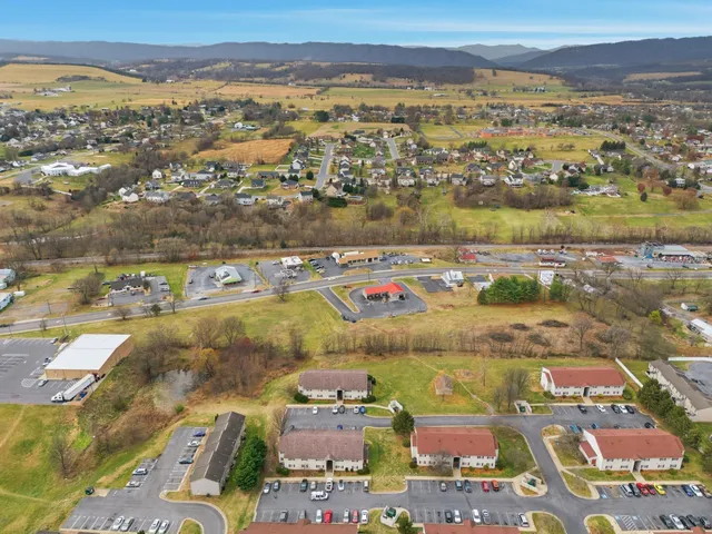 an aerial view of residential houses with outdoor space
