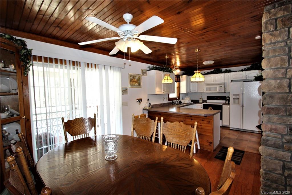 1244 Cameron Road Polkton, NC 28135 - Photo 11 of 19 a room with stainless steel appliances kitchen island granite countertop furniture and a fireplace