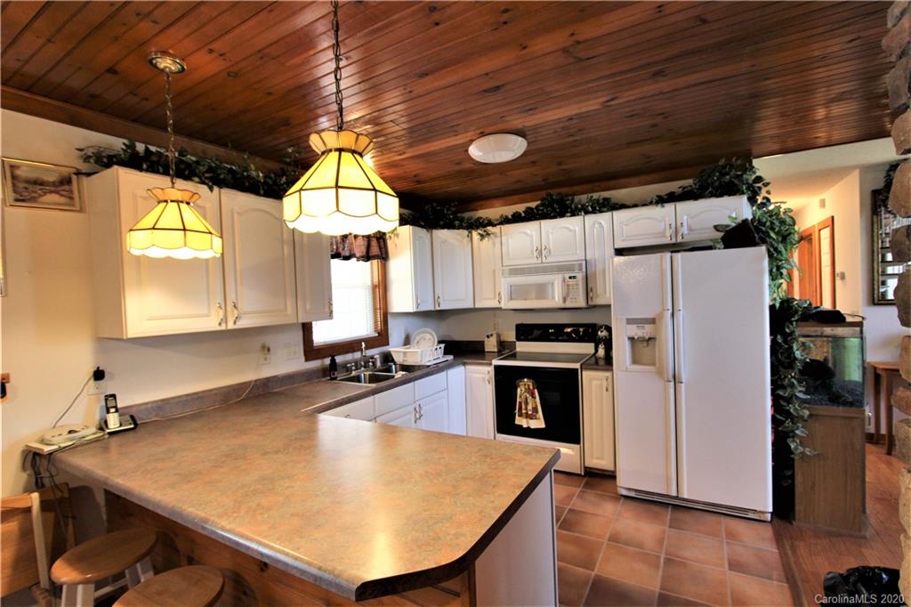 1244 Cameron Road Polkton, NC 28135 - Photo 13 of 19 a kitchen with refrigerator and window