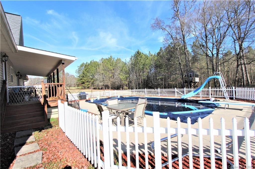 1244 Cameron Road Polkton, NC 28135 - Photo 3 of 19 a view of a house with backyard and sitting area