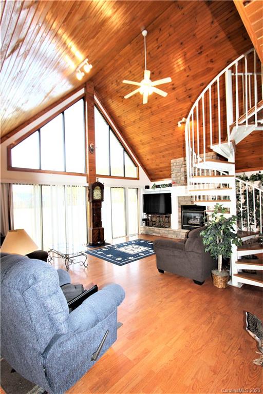 1244 Cameron Road Polkton, NC 28135 - Photo 5 of 19 a living room with furniture a flat screen tv and a large window